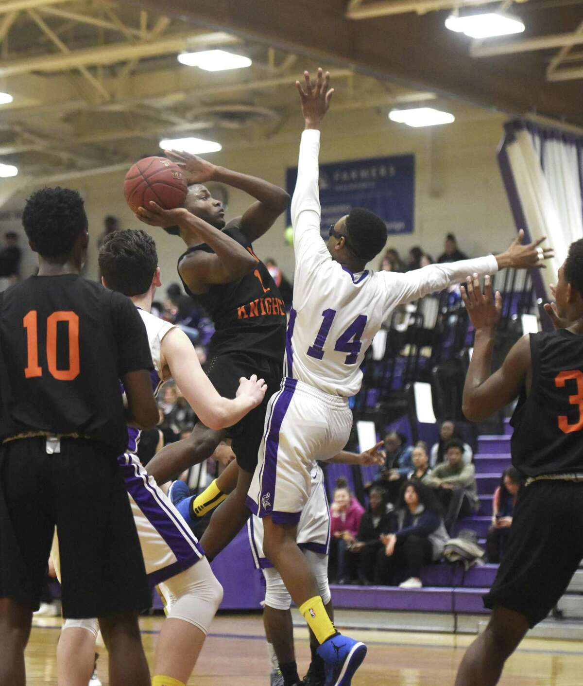 Stamford's Joh Thervil (1) goes up for a layup defended by Westhill's D'Aeren Carson (14) in the high school boys basketball game between Westhill and Stamford at Westhill High School in Stamford, Conn. Monday, Feb. 12, 2018.