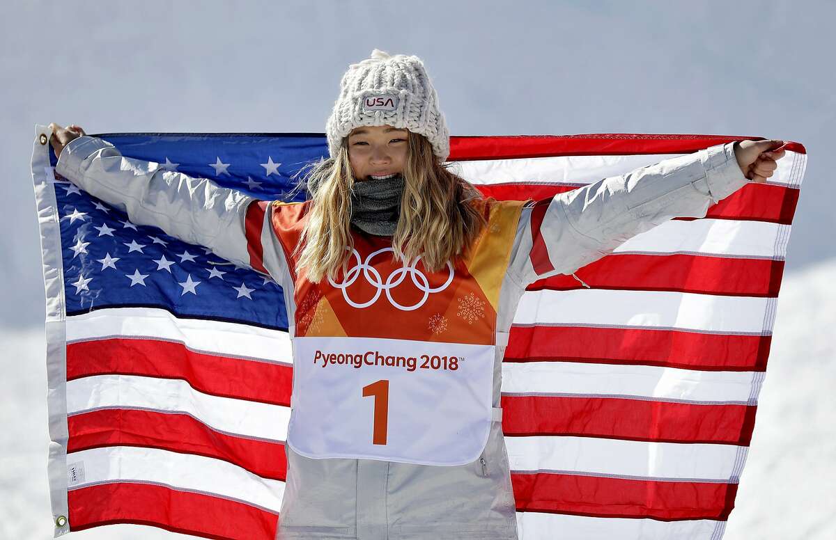 Chloe Kim, of the United States, celebrates winning gold in the women's halfpipe finals at Phoenix Snow Park at the 2018 Winter Olympics in Pyeongchang, South Korea, Tuesday, Feb. 13, 2018. (AP Photo/Gregory Bull)