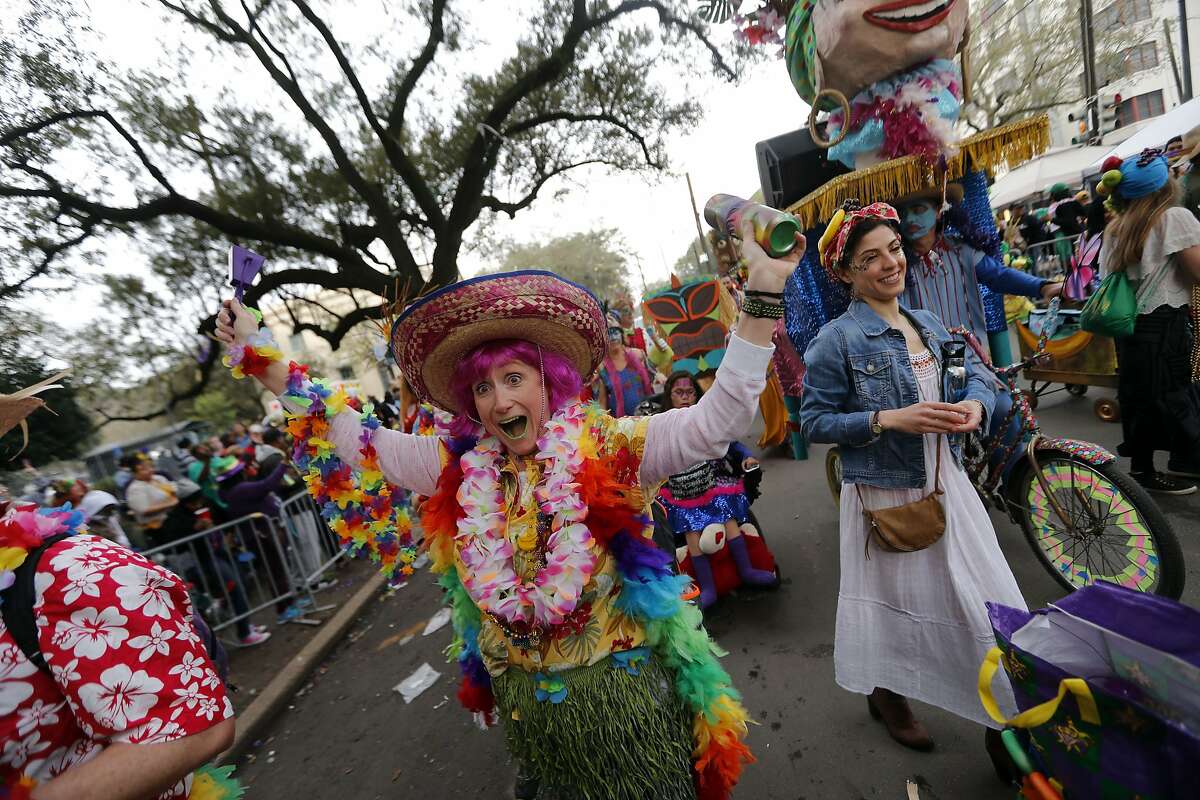 A member of the walking club Mondo Kayo revels as they march and dance down the route of the Krewe of Zulu parade on Mardi Gras day in New Orleans, Tuesday, Feb. 13, 2018. (AP Photo/Gerald Herbert)