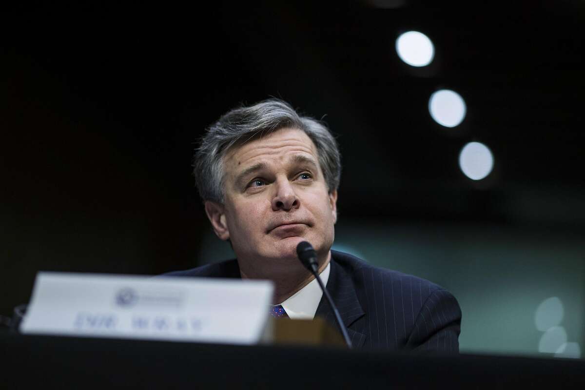 Christopher Wray, director of the Federal Bureau of Investigation (FBI), testifies during a Senate Intelligence Committee hearing on worldwide threats in Washington, D.C., U.S., on Feb. 13, 2018. From missiles to cyberattacks, the annual intelligence assessment of global threats paints a world where China and Russia seek to upend U.S. influence as allies uncertain of American commitment may turn away from Washington. Photographer: Zach Gibson/Bloomberg