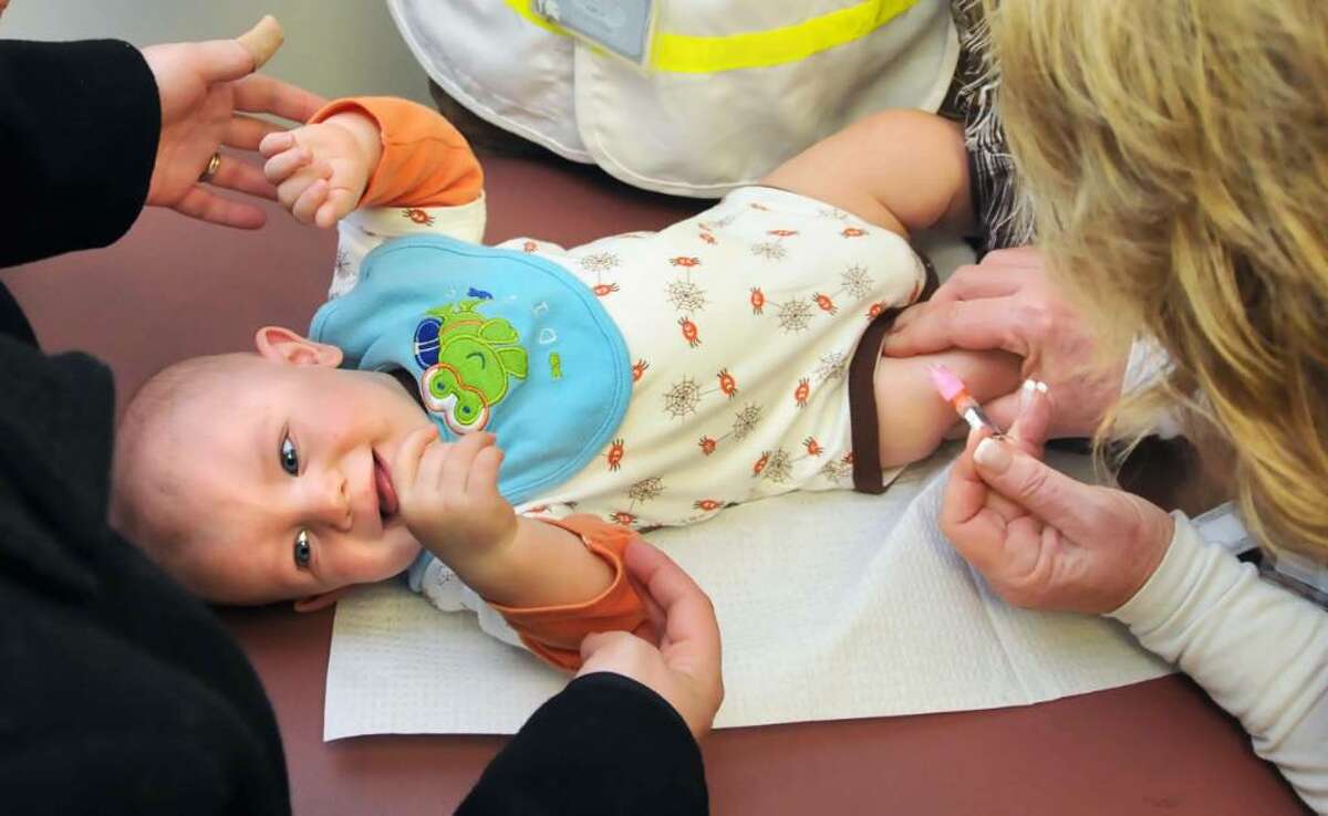 7-month-old Nathan Fischer of Niskayuna gets an H1N1 flu shot during a Schenectady County health department clinic for children under 5 years old at the Annie Schaffer Senior Center Tuesday afternoon November 10, 2009.