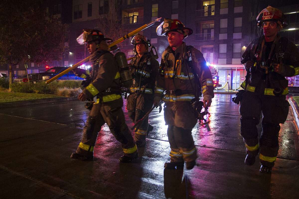 San Antonio firefighters outside the Agave Apartments on St. Mary's street in December of 2016.