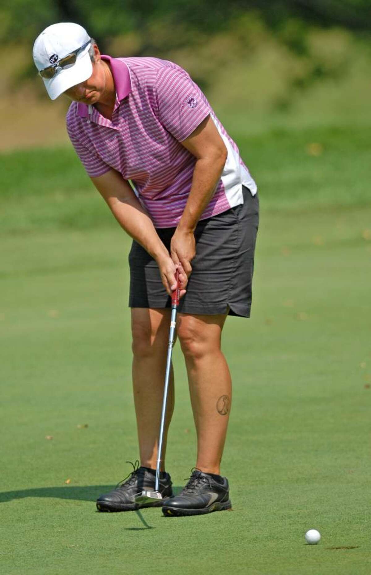 Pat Mayne makes a putt during the final round of the Northeastern Women's Golf Association championship. (Lori Van Buren / Times Union)