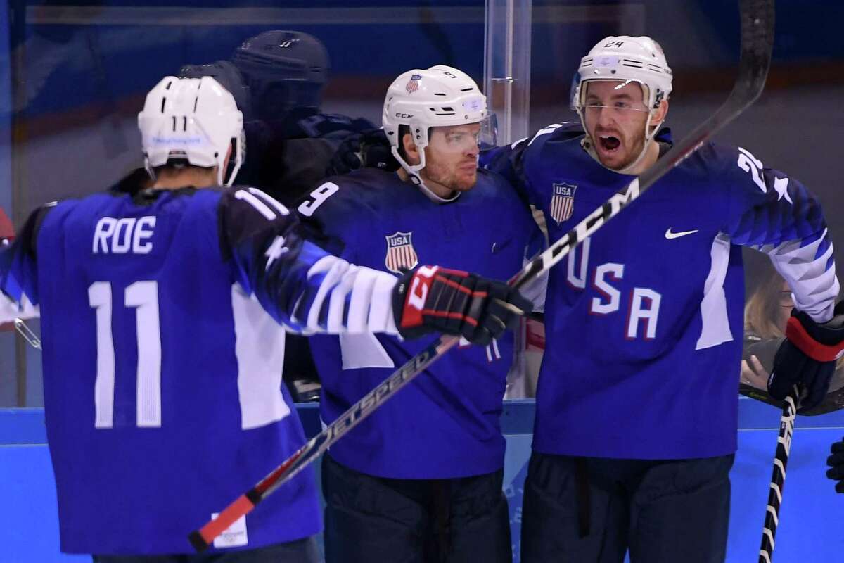 GANGNEUNG, SOUTH KOREA - FEBRUARY 14: Brian O'Neill #9 of the United States celebrates with teammates Jonathon Blum and Garrett Roe #11 after scoring a goal on Gasper Kroselj #32 of Slovenia in the first period during the Men's Ice Hockey Preliminary Round Group B game on day five of the PyeongChang 2018 Winter Olympics at Kwandong Hockey Centre on February 14, 2018 in Gangneung, South Korea. (Photo by Harry How/Getty Images)