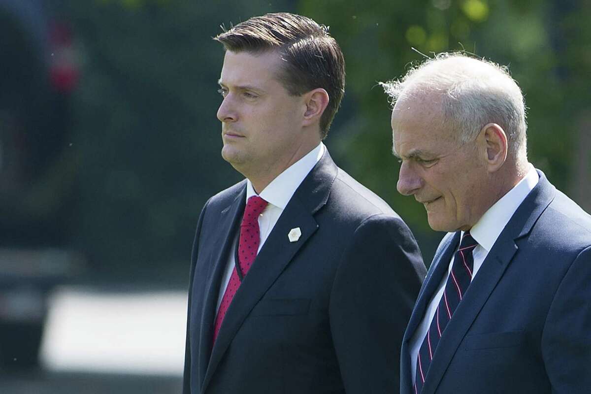 (FILES) White House Chief of Staff John Kelly (R) and White House Staff Secretary Rob Porter (L)walk to Marine One prior to departure from the South Lawn of the White House in Washington, DC, August 4, 2017. Close Trump aide Rob Porter stepped down from his post as staff secretary on February 07, despite his denial of grim accusations of abuse by his two ex-wives. It has since emerged that Porter did not receive full security clearance because of the allegations, but nevertheless worked at the president's side day in and day out, handling highly classified material. / AFP PHOTO / SAUL LOEBSAUL LOEB/AFP/Getty Images