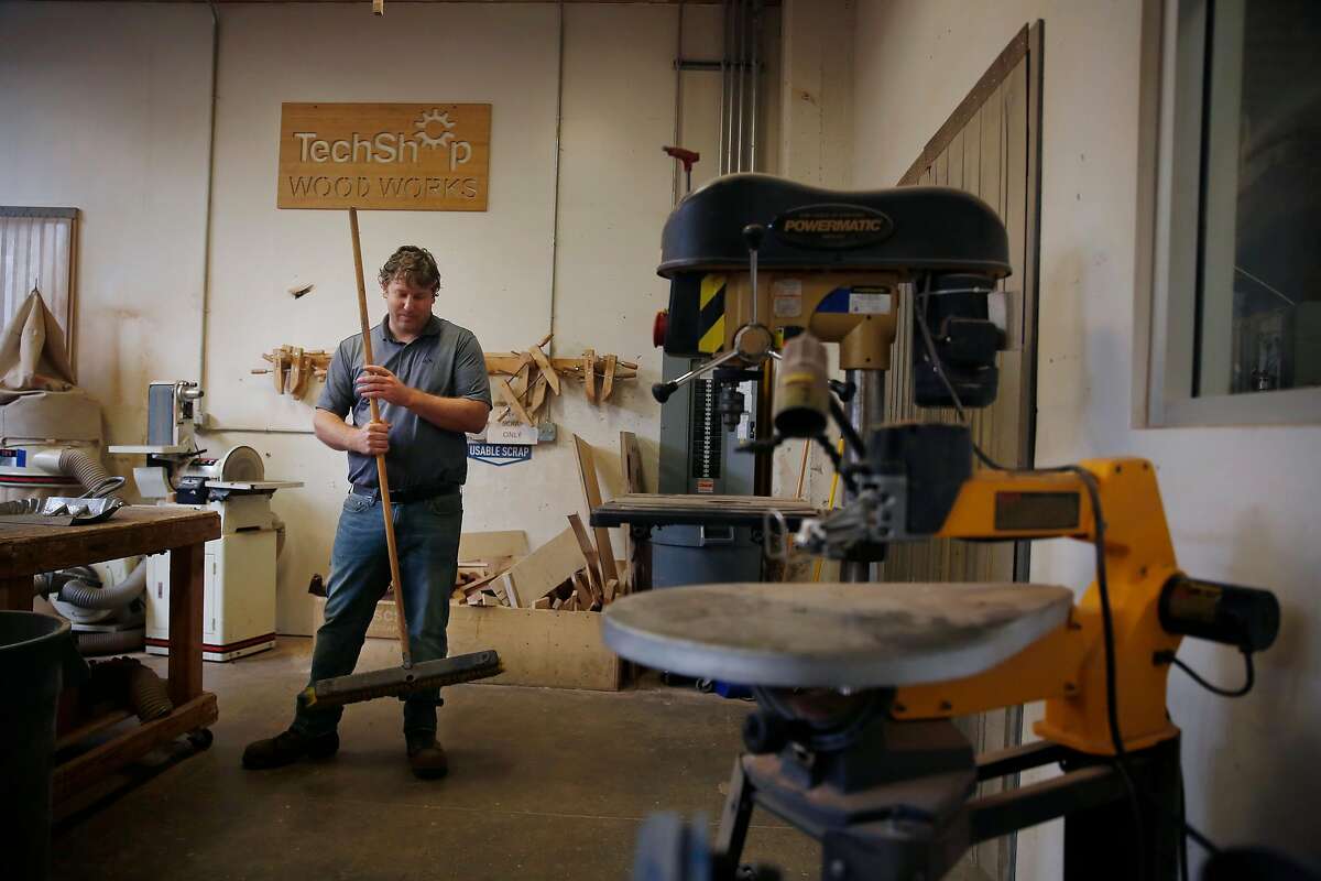 Dan Rasure, chief operating officer Tech Shop, sweeps the floor in the woodworks section of the TechShop as he prepares for the February 19 opening in San Francisco, Calif., on Wednesday, February 14, 2018.