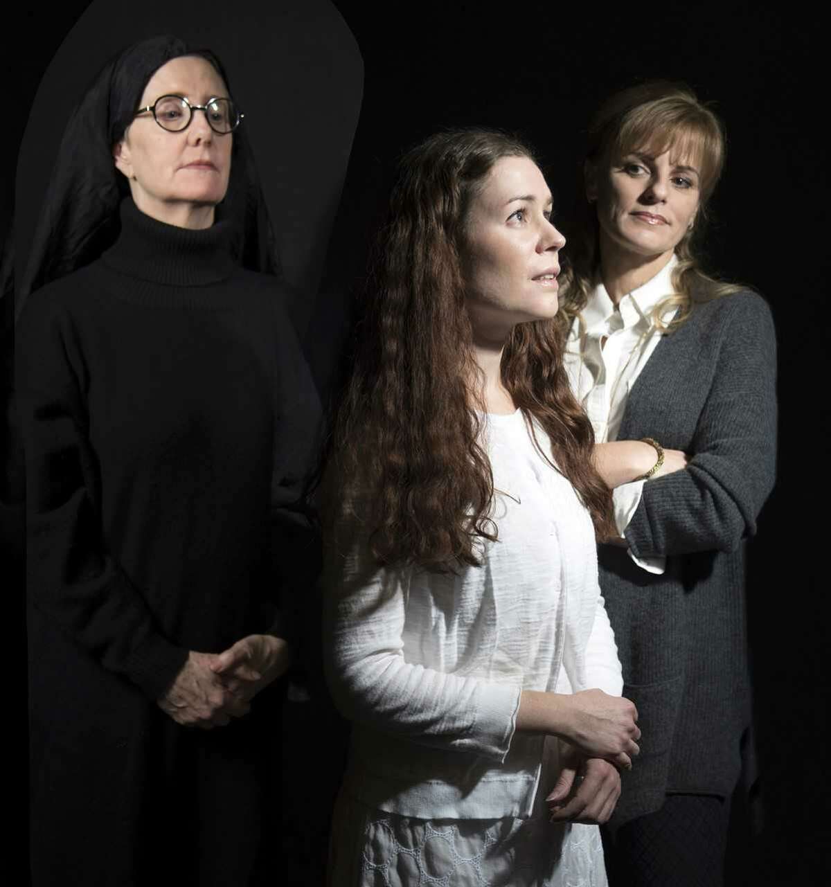 Summoned to a convent, Dr. Martha Livingstone (Yvonne Perry, right) a court-appointed psychiatrist, is charged with assessing the sanity of a novice (Jacqueline Donnaruma, center) accused of murdering her newborn, under the watchful eye of Miriam Ruth, the Mother Superior (Leigh Strimbeck, left) in "Agnes of God". Theater Voices will present a staged reading of John Pielmeier's compelling play, directed by Maggie Mancinelli-Cahill, on February 16 at 8pm, February 17 at 3 & 8pm and February 18 at 3pm, at Steamer No. 10 Theatre, 500 Western Avenue, Albany. Admission is free. Please credit: Photo by Katria Foster