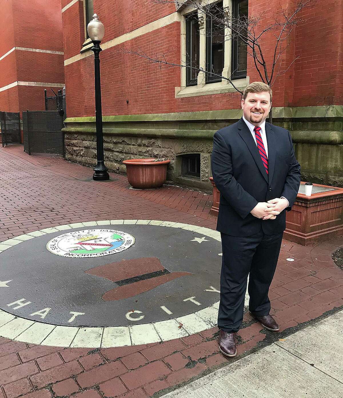 Newly named Greater Danbury Chamber of Commerce President and CEO P.J. Prunty stands in downtown Danbury, Conn., on Thursday, Feb. 15, 2018.