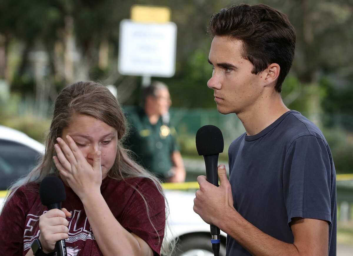 Students Kelsey Friend (L) and David Hogg recount their stories about yesterday's mass shooting at the Marjory Stoneman Douglas High School where 17 people were killed, on February 15, 2018 in Parkland, Florida. Police arrested the suspect after a short manhunt, and have identified him as 19 year old former student Nikolas Cruz.