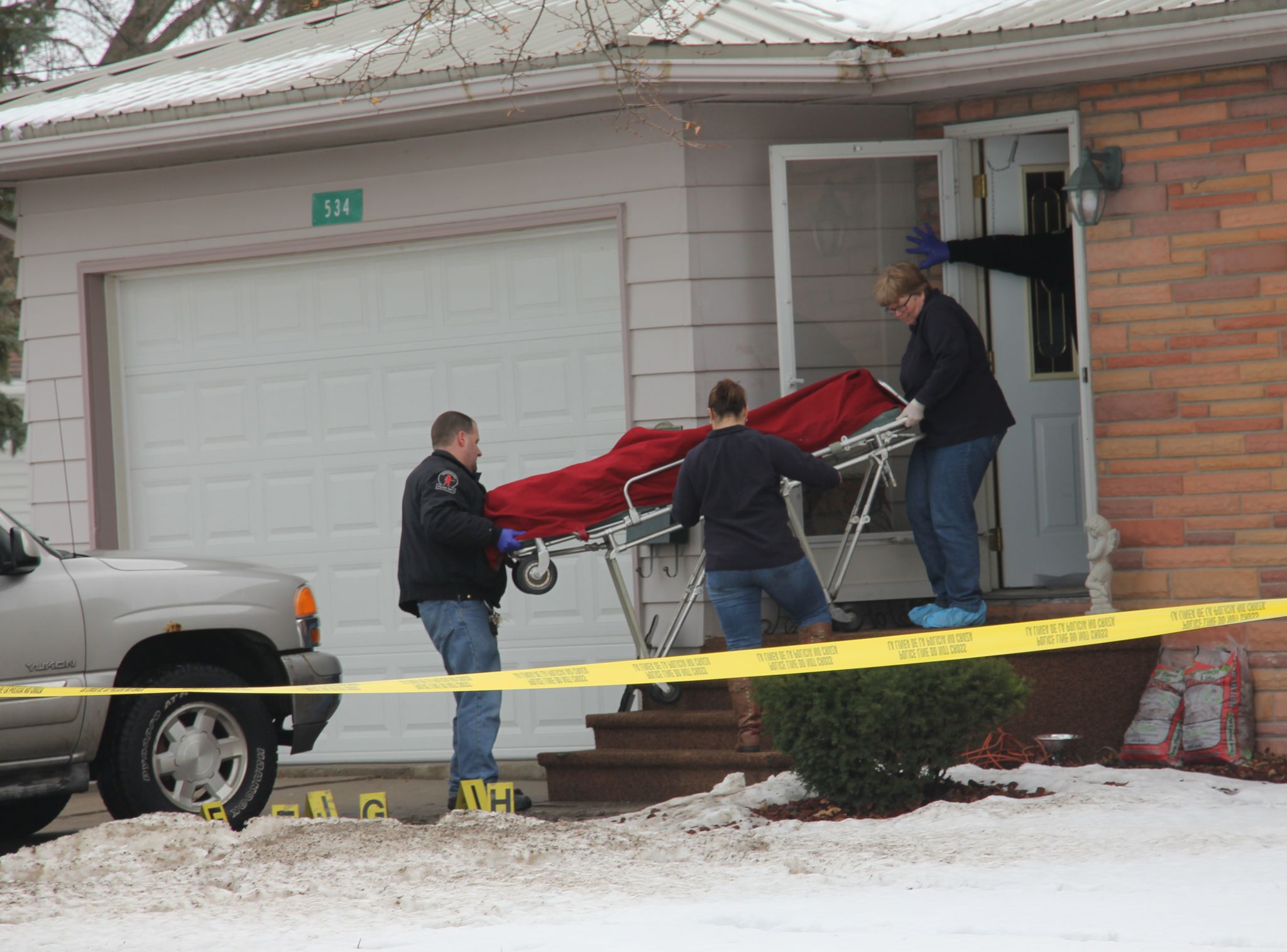 Authorities remove bodies from the scene of Sebewaing shooting