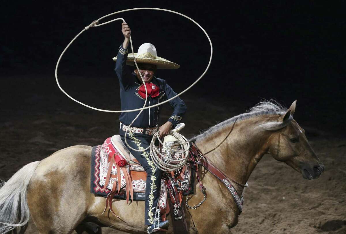 Charro performer Tomas Garcilazo and his horse, "Hollywood," entertain the crowd at the San Antonio Stock Show and Rodeo, Wednesday, Feb. 14, 2018.