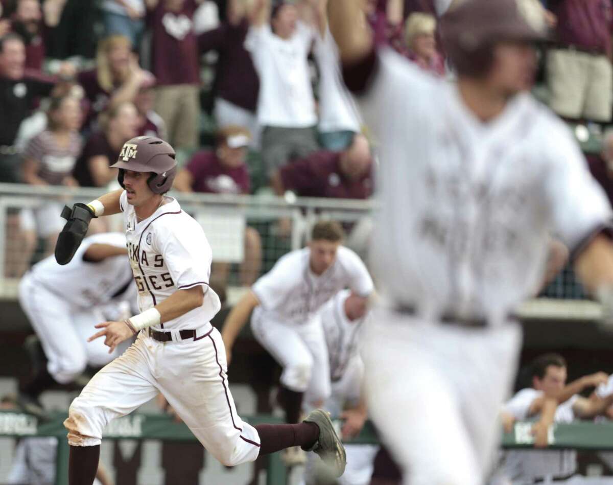 Texas A&M infielder Braden Shewmake (8) runs toward home as Texas A&M infielder George Janca (44) hit an RBI walk off single off Davidson pitcher Westin Whitmire to win 7-6 in 15 innings during the NCAA baseball Super Regional at Olsen Field at Blue Bell Park on Friday, June 9, 2017, in College Station. ( Brett Coomer / Houston Chronicle )