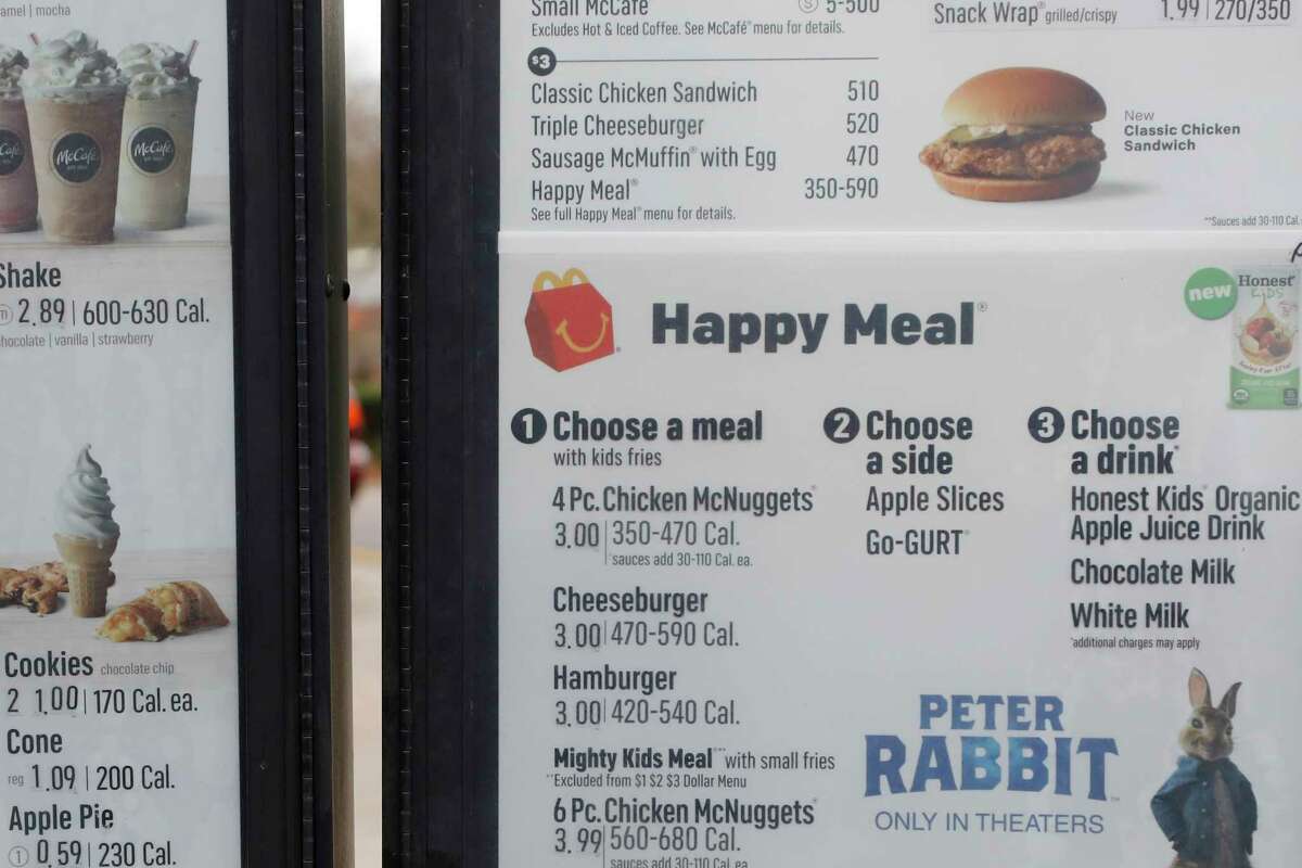 The drive thru menu panel featuring Happy Meals at a McDonald's Restaurant 