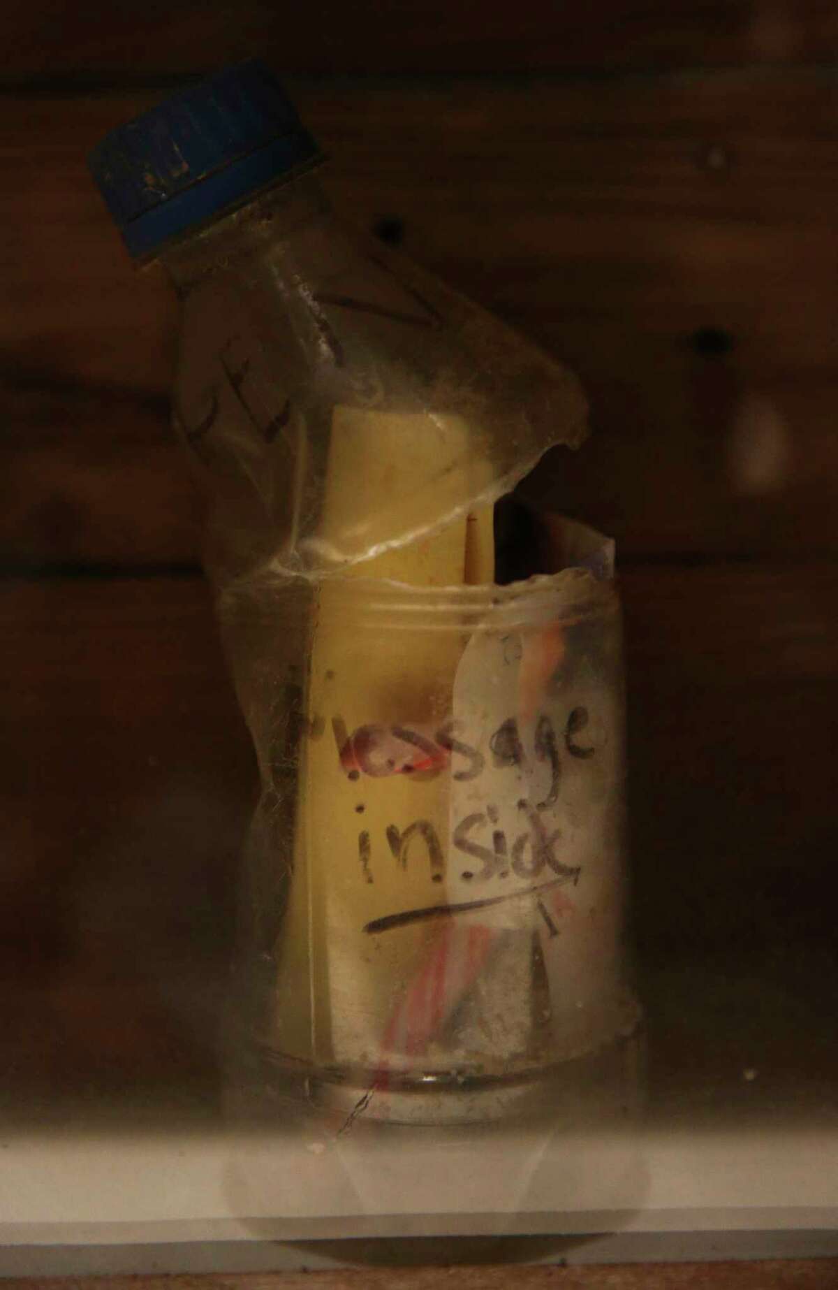 The bottle that asks the founder to open it and read the message in side is a part of The Message in at Bottle exhibition at the Houston Museum of Natural Science on Wednesday, Feb. 14, 2018, in Houston. Chad Pregracke, the Living Lands & Waters crew and volunteers found bottles that contain messages since 1998 while cleaning up Mississippi River, Missouri River, Illinois River and Ohio River. ( Yi-Chin Lee / Houston Chronicle )