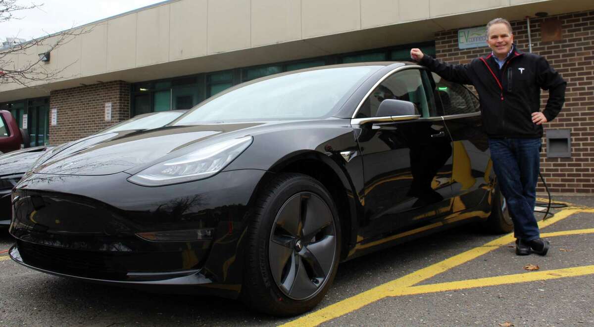 Westport resident Bruce Becker displayed his new Tesla Model 3 vehicle at an event at Staples High School on Feb. 14.
