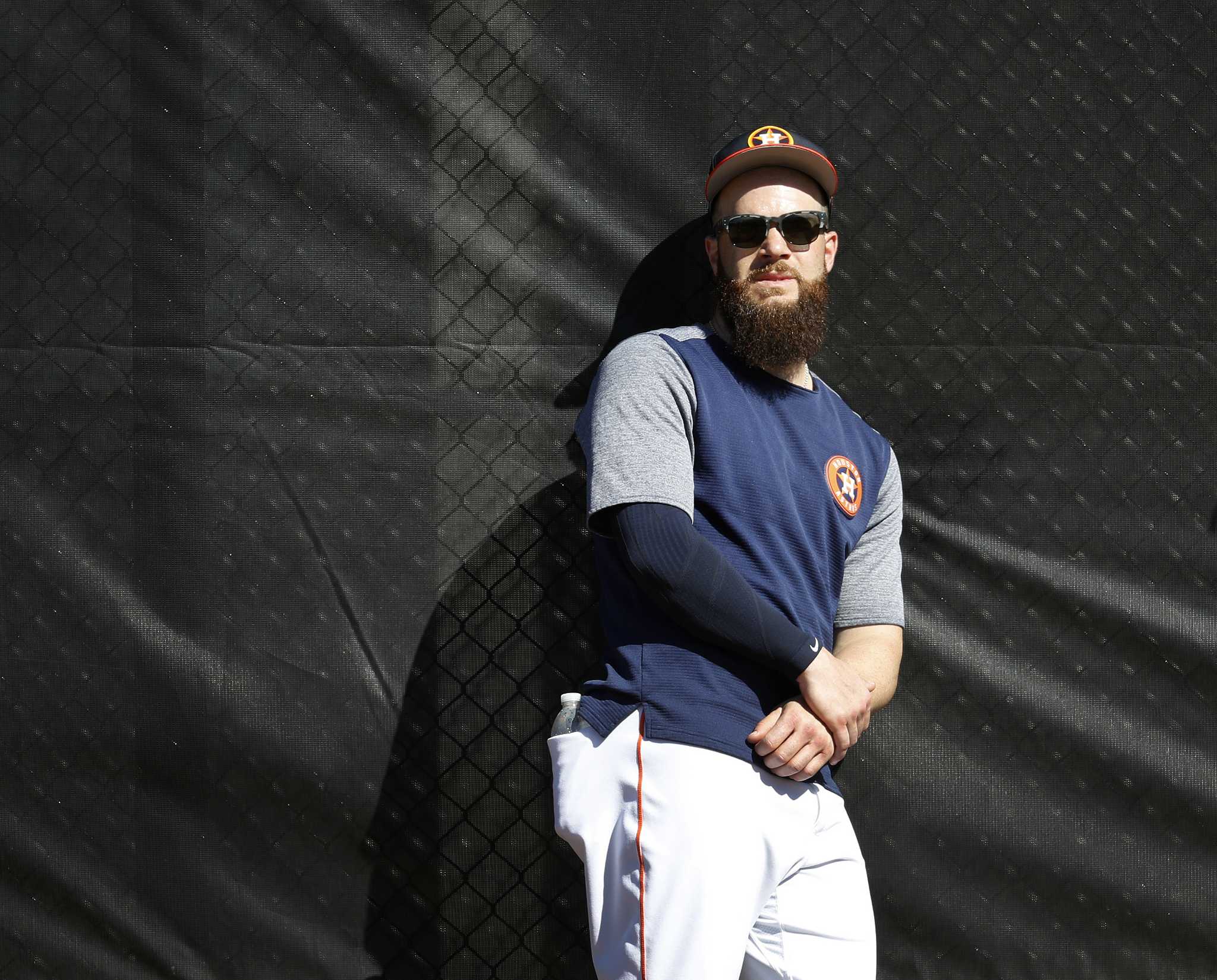 Dallas Keuchel of the Houston Astros tugs on his beard as he looks