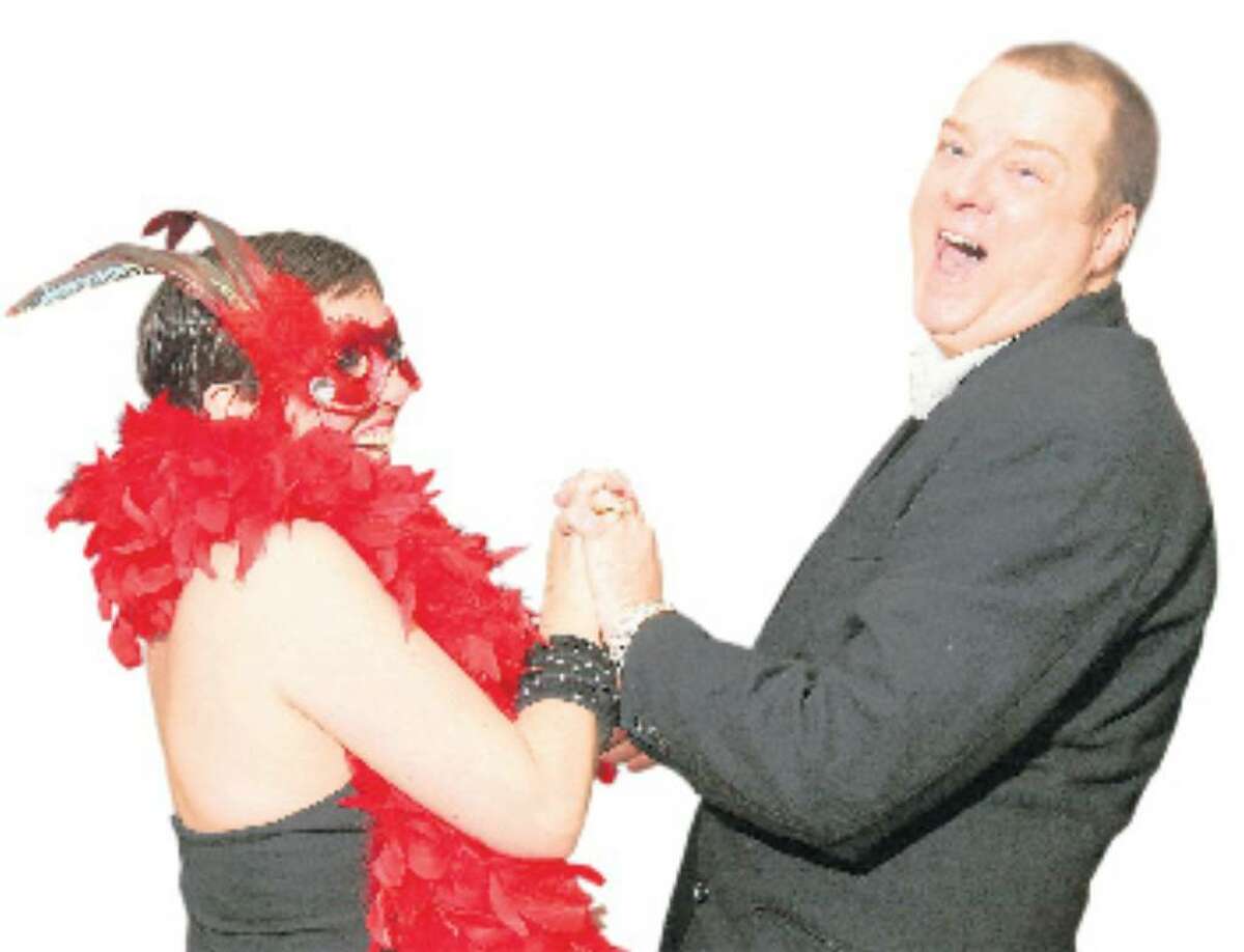 TARA COSGROVE, left, and Richard Roe tear up the dance floor at Hattie?s Annual Mardi Gras Soir? last year. This year?s event takes place Saturday at Canfield Casino. (JOE PUTROCK / SPECIAL TO THE TIMES UNION)