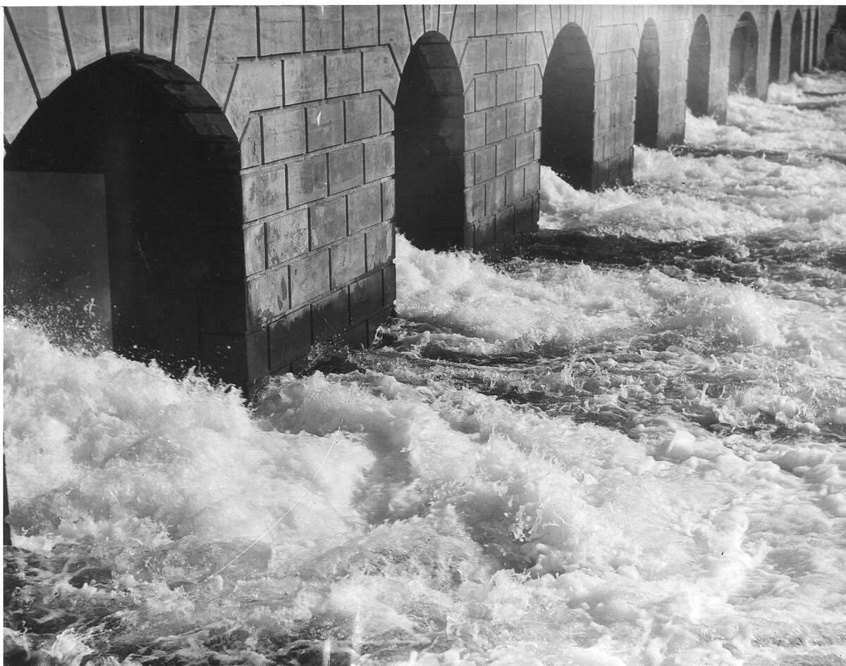 Water flows through the Moccasin Power House, generating electricity. The flow of water here is 580,000,000 gallons a day. October 26, 1934 Associated Press photo