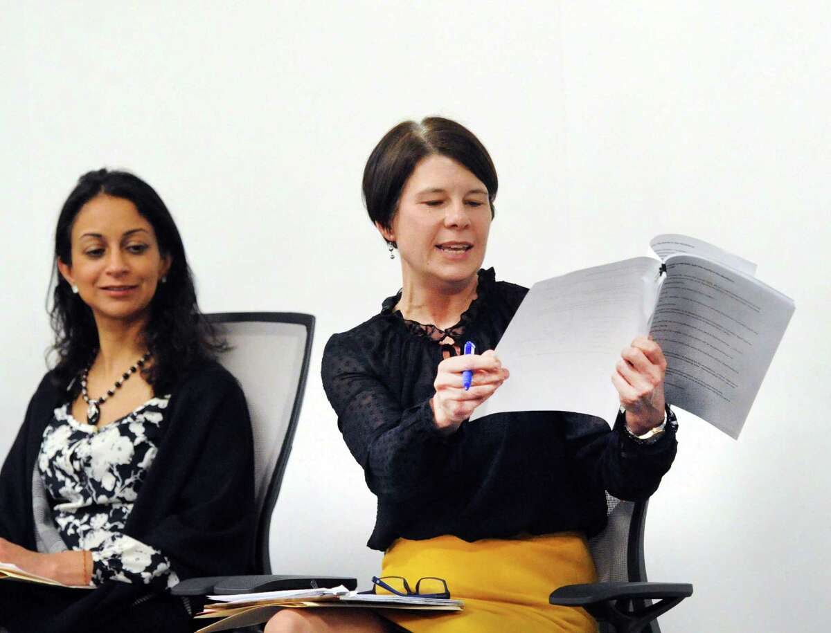 At right, Carolyn Treiss of the Connecticut Department of Labor, makes a point about pay equity for women as fellow panelist Dita Bhargava of Greenwich, a former Wall Street trader and Democrat who is considering a run for governor, listens after the screening of the film "Battle of the Sexes" featuring the life story of tennis great Billie Jean King's 1973 matchup with Bobby Riggs at Fairfield County's Community Foundation in Norwalk, Conn., Thursday night, Feb. 15, 2018.