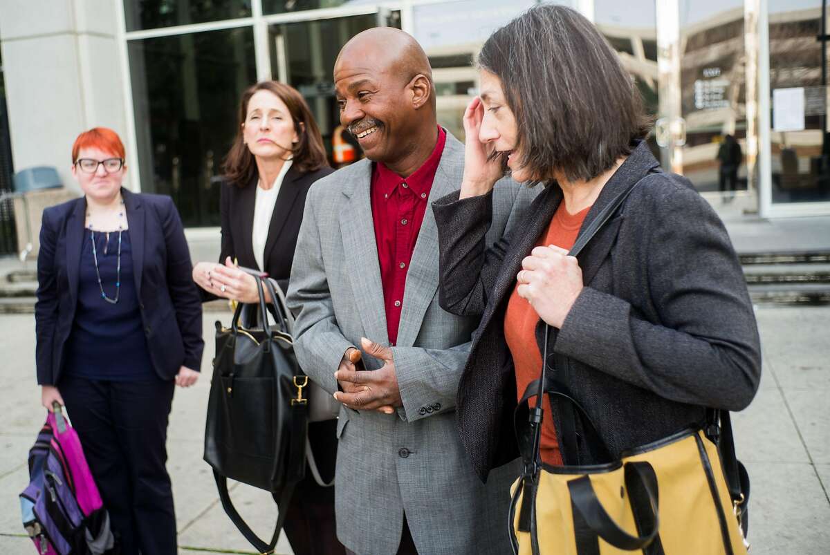 Glenn Payne laughs with members of the Northern California Innocence Project at the Hall of Justice in San Jose, Calif. on Friday, Jan. 26, 2018. Payne served 13 years in prison for child molestation, but the Northern California Innocence Project helped get that conviction thrown out.