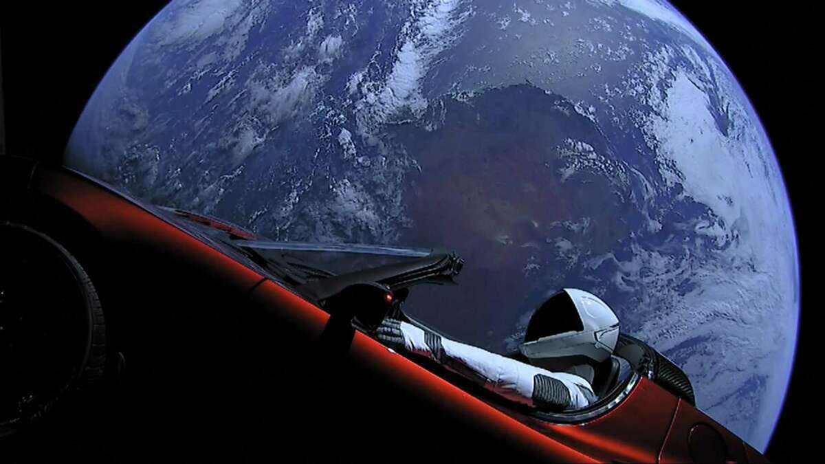 This image from SpaceX shows the company's spacesuit in Elon Musk's red Tesla sports car which was launched into space during the first test flight of the Falcon Heavy rocket on Tuesday, Feb. 6, 2018. (SpaceX)