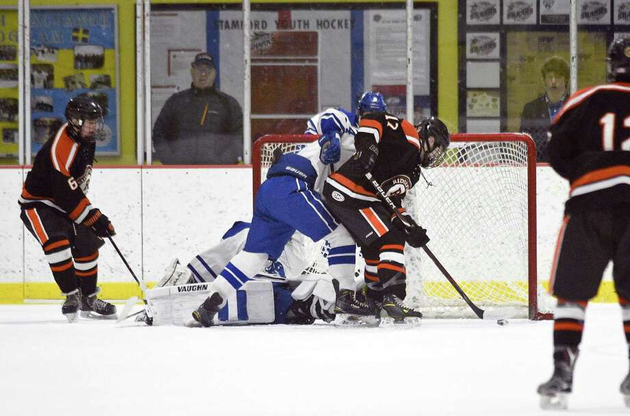 Boys Hockey: No. 2 Ridgefield fends off Darien