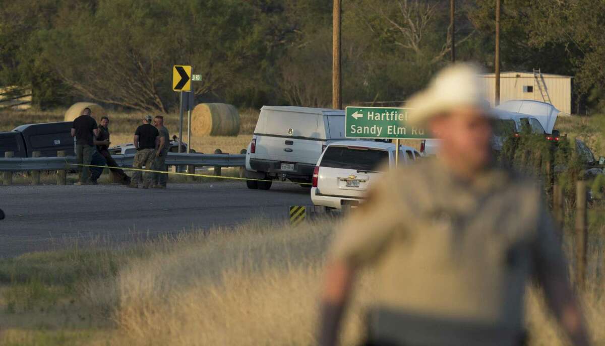 The scene near the intersection of FM 539 and Sandy Elm Road in Guadalupe County is secured Sunday, Nov. 5, 2017 where the alleged shooter in the Sutherland Springs First Baptist Church church shooting that killed at least 25 people fled to in a vehicle. The alleged shooter, identified by the New York Times News Service as Devin P. Kelley, 26, died at the scene but officials haven't said how he dies.