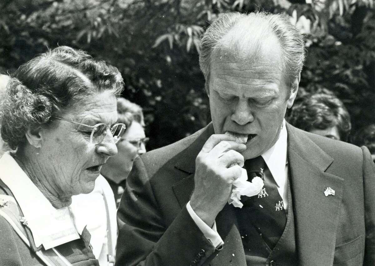 In a Express-News file photo of President Gerald Ford attempts to eat a tamal, shuck and all, April 9,1976.