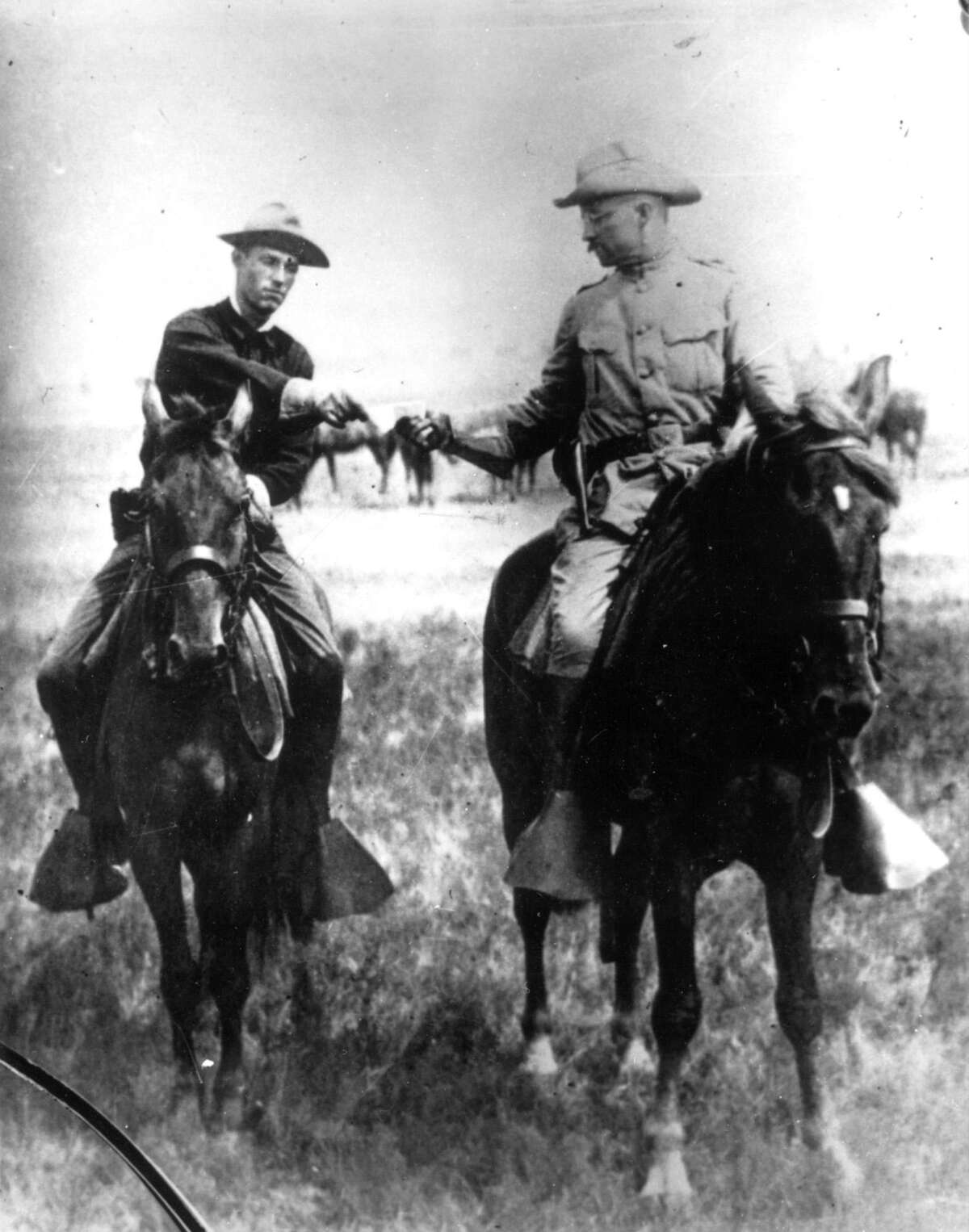 President Theodore Roosevelt coined the phrase “bully pulpit.” In his day, “bully” meant “excellent” or “first rate. ” Here, Col. Roosevelt receives a dispatch while in San Antonio training his Rough Riders in 1898.