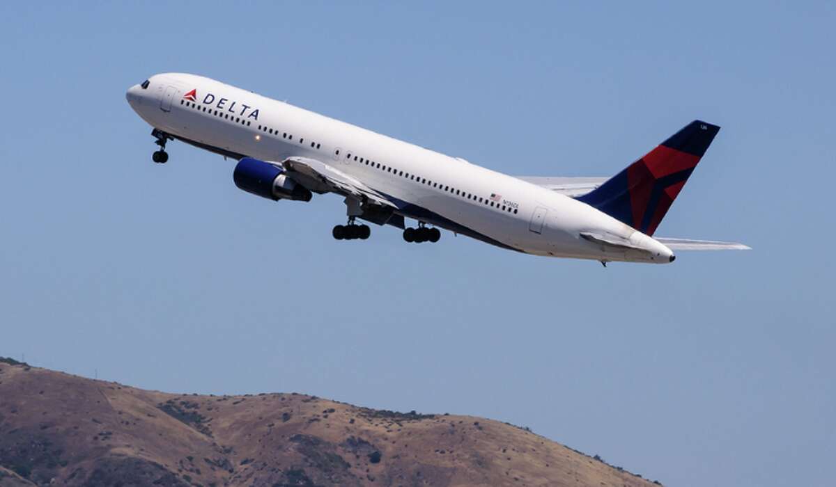 Delta airplane flies out of SFO.