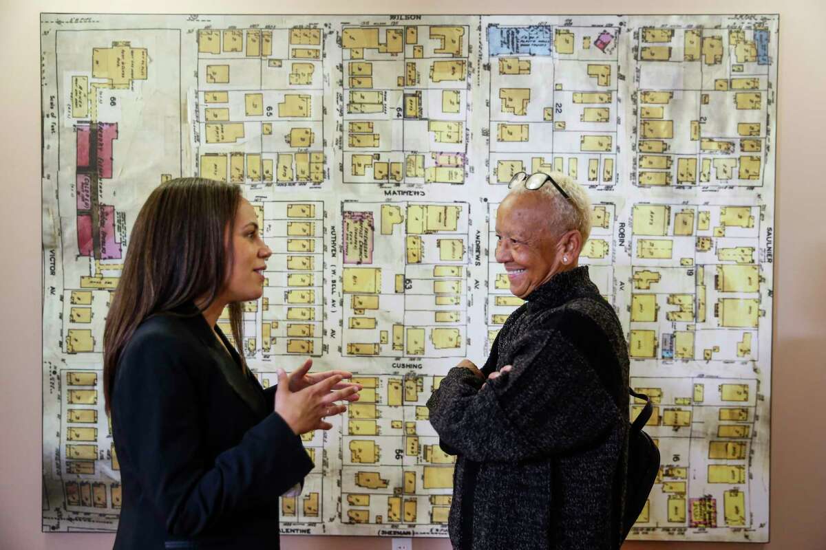 Poet Nikki Giovanni, right, stands in front of a map of Freedmen's Town as she takes a tour of the African American Library at the Gregory School with library manager and curator Danielle Wilson, left, Thursday, Feb. 15, 2018 in Houston. Giovanni will be speaking about her new book, A Good Cry, at the UH Cullen Performance Hall Thursday night.
