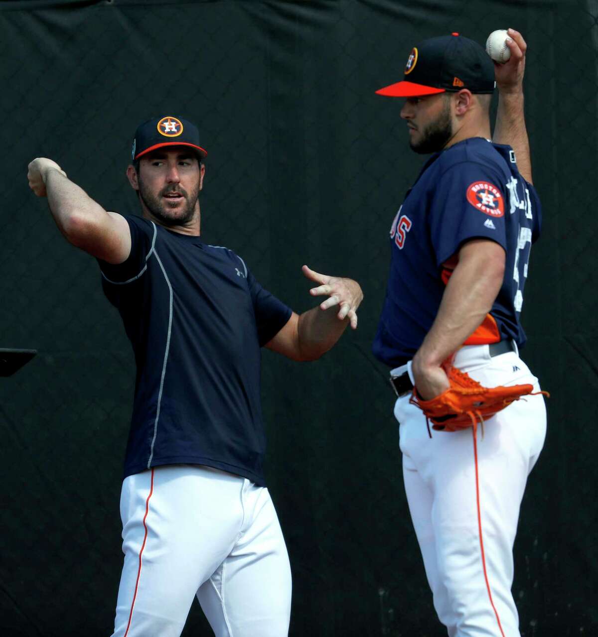 Houston Astros pitchers Justin Verlander (35) and Lance McCullers Jr. (43) work together as they consulted with Astros Director of Player Development, Pete Putila, in the bullpen during spring training at The Ballpark of the Palm Beaches, Saturday, Feb. 17, 2018, in West Palm Beach .