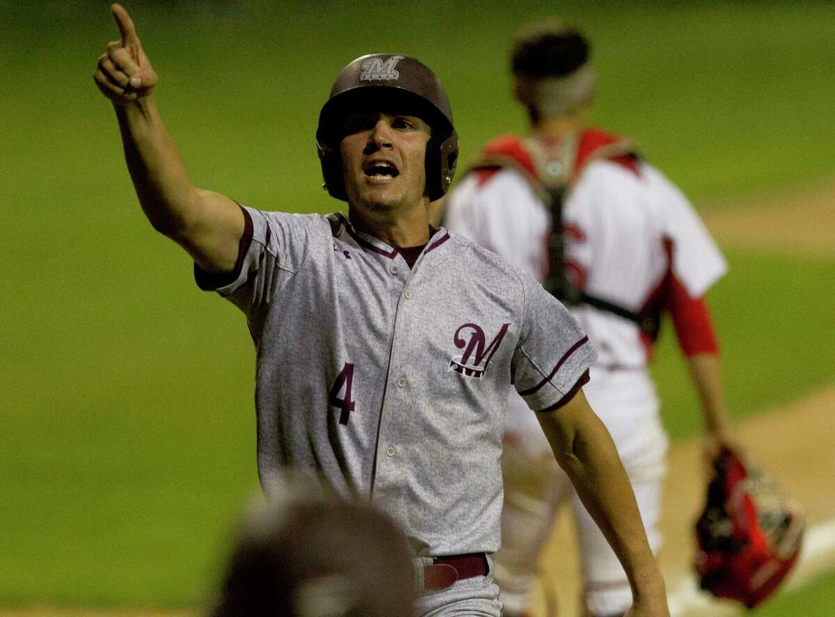 Jordan Groshans celebrates as he scores the winning run on a RBI single by Kevin Black to break a 2-2 tie during the 11th inning of a District 20-5A high school baseball game Thursday, March 16, 2017, in Tomball.