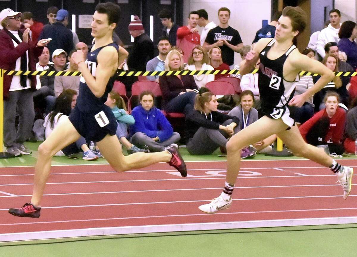 Staples’ William Landowne stays ahead of Warde’s Alex Mocarski in the 1,600-meter run at the 2018 FCIAC championships. Mocarski finished second in 4:22.88.