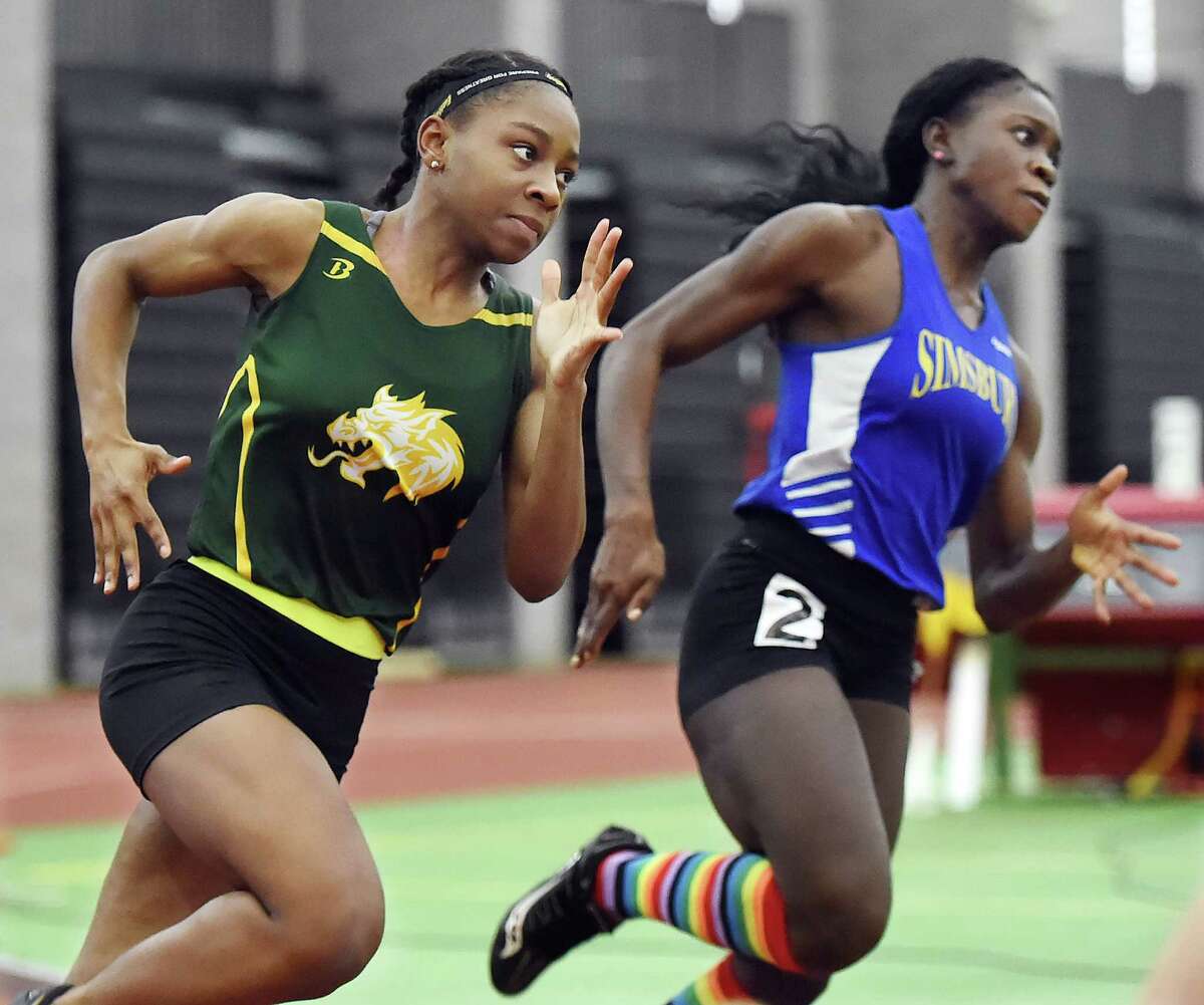 Hamden senior Aisha Gay finishes first in the 300 meter run in 39.56 at the CIAC Indoor Track & Field State Open, Saturday, Feb. 17, 2018, at Floyd Little Athletic Center at Hillhouse High School in New Haven. Simsbury senior Dinedye Denis placed third in 40.24.