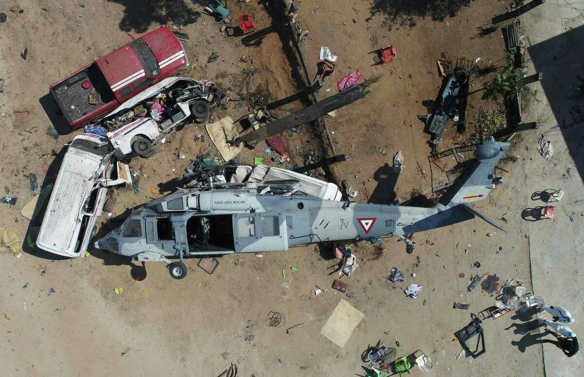View of the helicopter that fell on a van in Santiago Jamiltepec, Oaxaca state, Mexico, on Saturday following Friday's 7.2-magnitude earthquake. The crash killed 13 people, including three children.