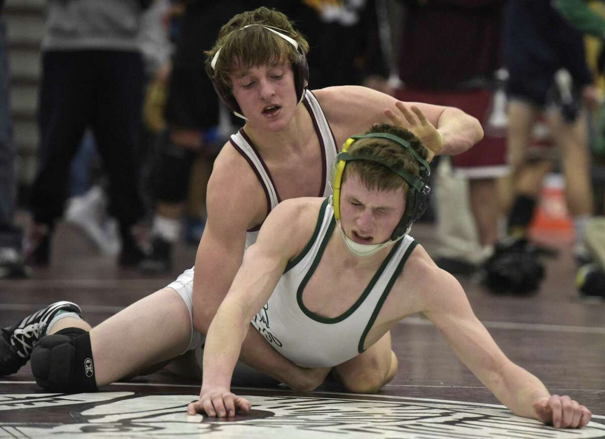 Christopher Trelli, Bristol Central High School, and Brandon Leonard, New Milford High School, wrestle in the 120 pound weight class for the championship in the Connecticut Class L wrestling tournament, Saturday, February 17, 2018, at Bristol Central High School, Bristol, Conn.
