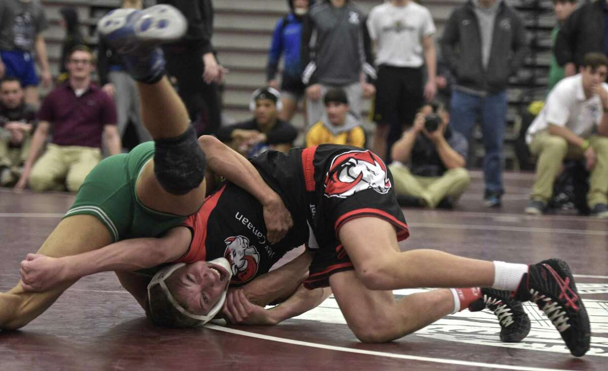 Melquisedec Ortiz, New Milford High School, and Justin Mastroianni, New Canaan High School, wrestle in the 126 pound weight class for the championship of the Connecticut Class L wrestling tournament, Saturday, February 17, 2018, at Bristol Central High School, Bristol, Conn.