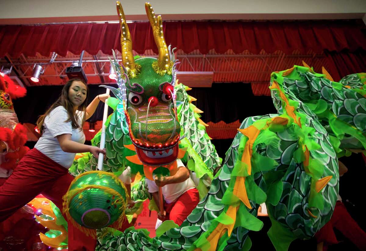 Members of the Shaolin Temple Cultural Center ﻿dance during a Lunar New Year celebration at the Chinese Community Center in southwest Houston on Saturday﻿.