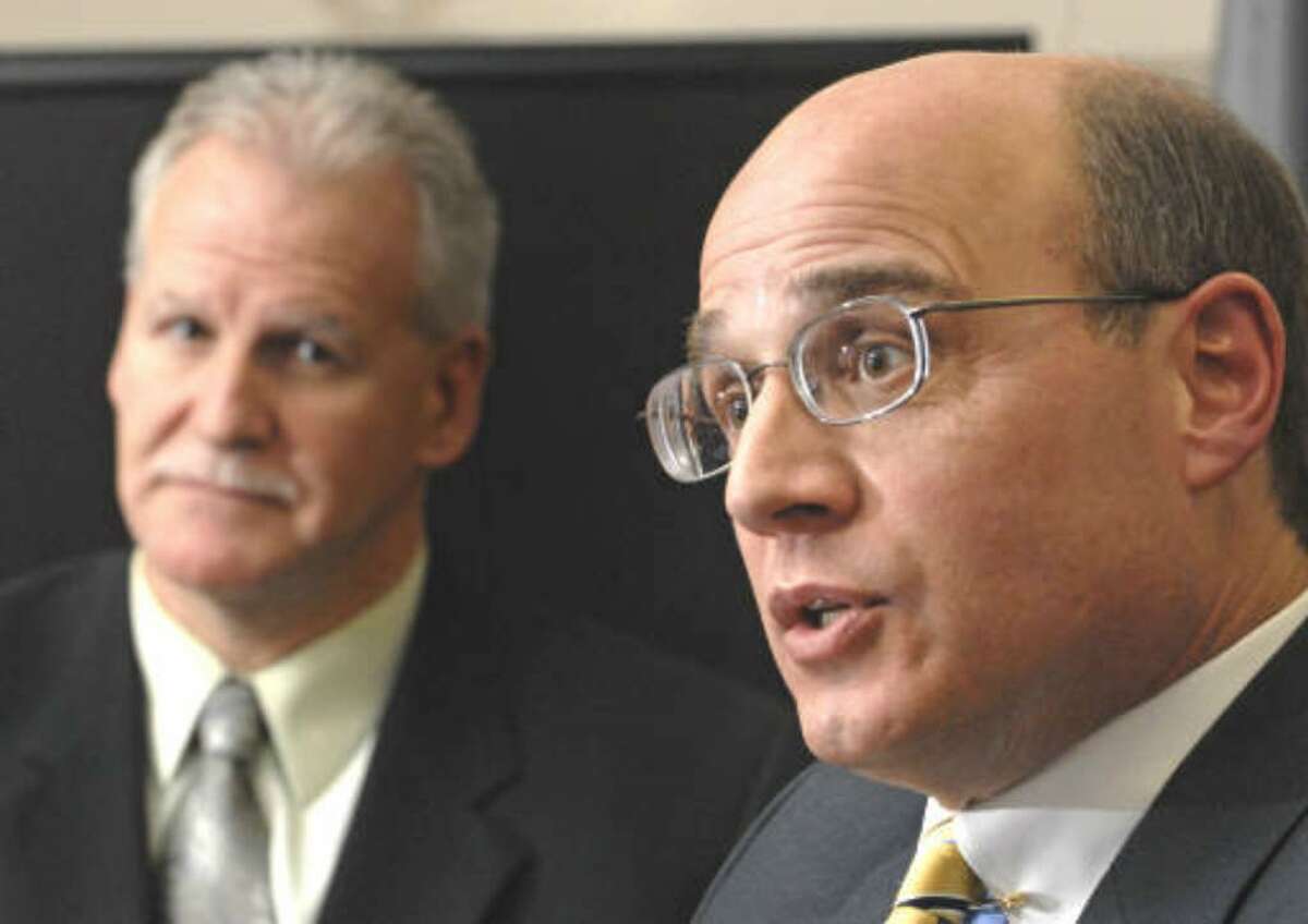 Acting U.S. Attorny Andrew T. Baxter answers questions from Times Union reporters during an exclusive meeting at the Federal Courthouse in Albany , NY on December 10, 2009. John Pikus, FBI's special agent in charge of Albany, listens next to him. (Lori Van Buren / Times Union)