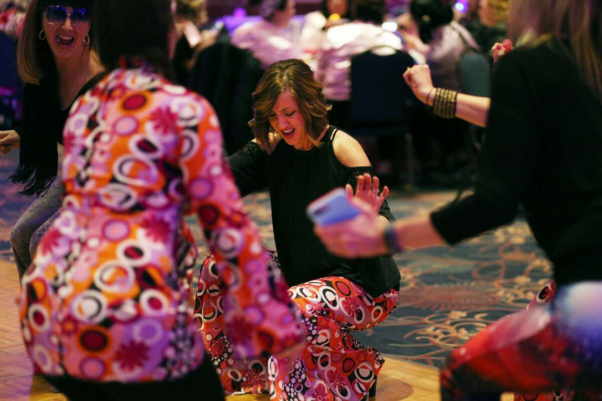 Kari Back of Freeland dances with friends during Mom Prom at the Great Hall Banquet & Convention Center on Saturday. (Samantha Madar/for the Daily News)