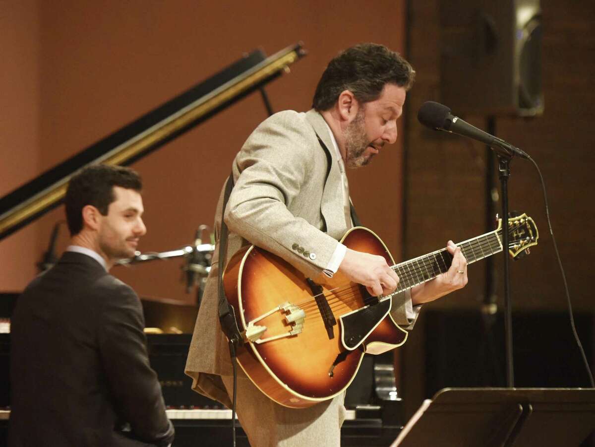 Jazz guitarist and singer John Pizzarelli performs at Greenwich Library's Cole Auditorium in Greenwich, Conn. Sunday, Feb. 18, 2018. Pizzarelli is a virtuoso who performs mostly modern interpretations from the Great American Songbook.