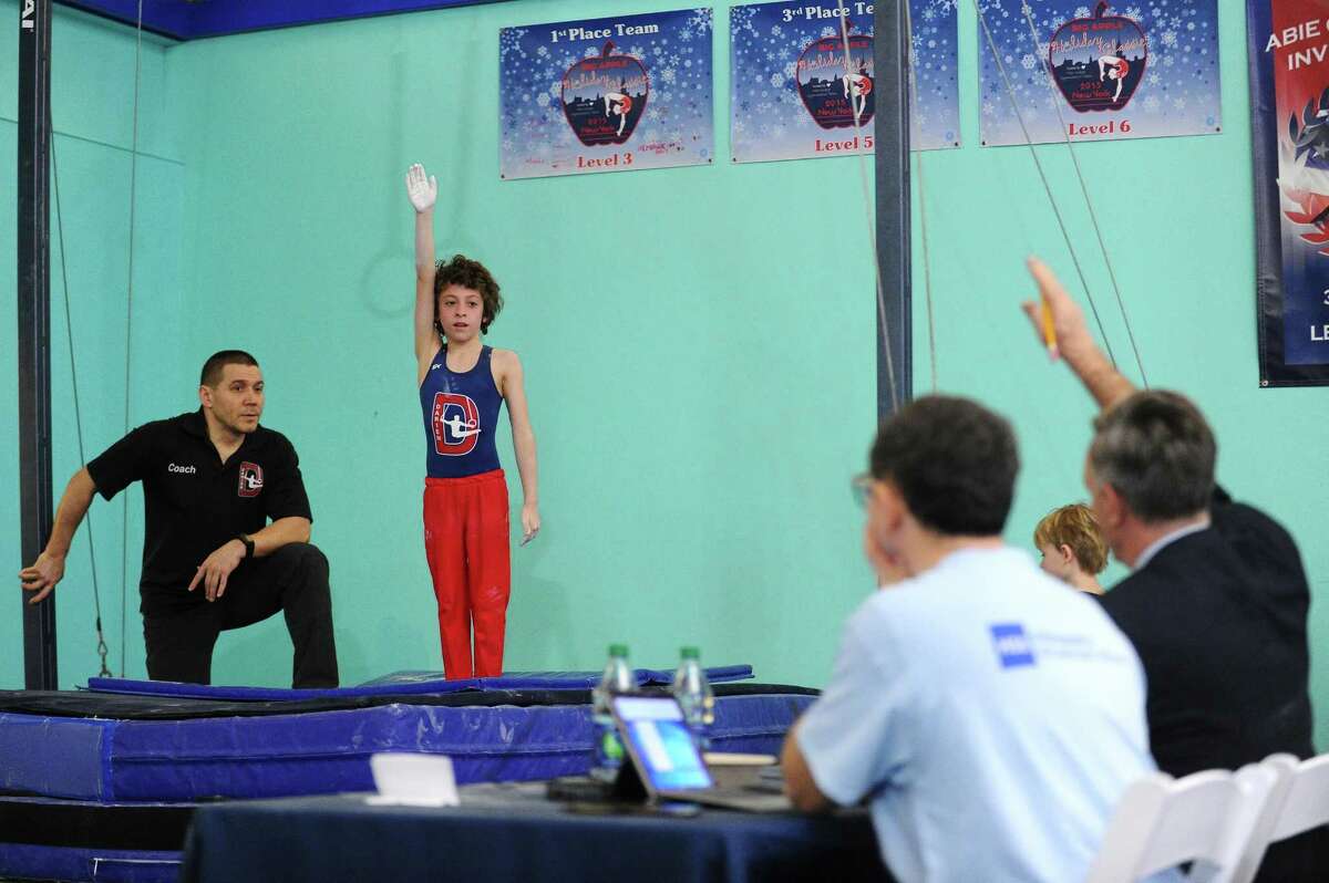 Nine-year-old Monty Bell, of Darien, performs on the rings during the fifth annual Winter Challenge gymnastics meet at Chelsea Piers on Blachley Road in Stamford, Conn. on Sunday, Feb. 18, 2018. 54 teams of approximately 900 athletes from six states participated in the annual USAG certified meet.