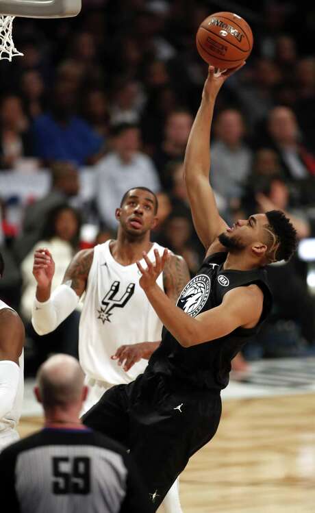 Team Stephen's Karl-Anthony Towns scores against Team LeBron's LaMarcus Aldridge in 1st quarter during NBA All Star Game at Staples Center in Los Angeles, Calif., on Sunday, February 18, 2018. Photo: Scott Strazzante, Staff Photographer / The Chronicle / San Francisco Chronicle