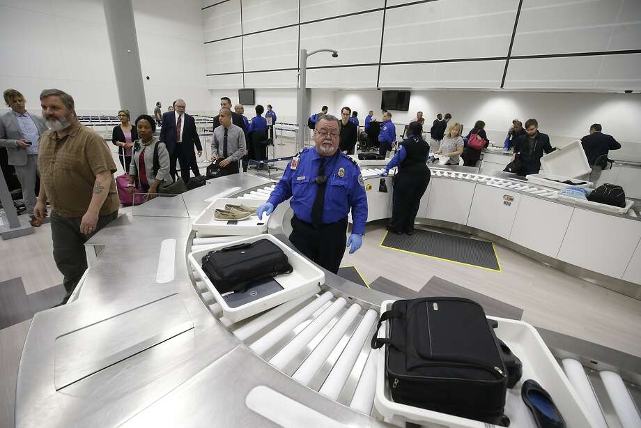 germophobes: beware those plastic tsa bins