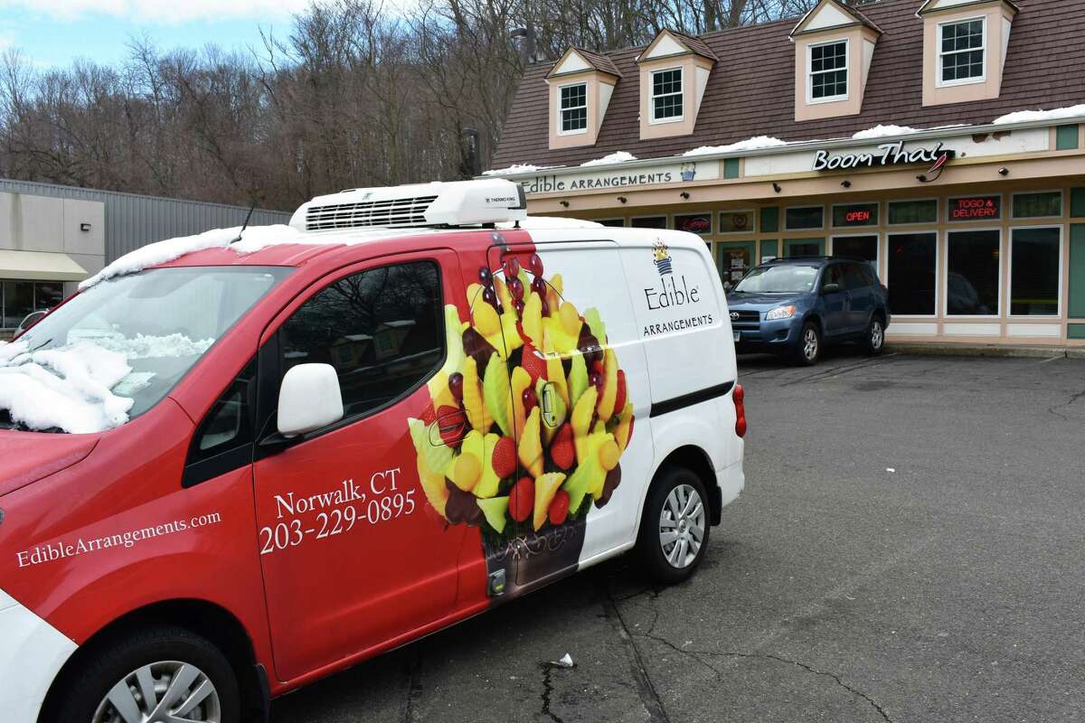 An Edible Arrangements delivery van and storefront at 456 Main Ave. in Norwalk, Conn., in mid-February 2018. On Feb. 5, 2018, the Wallingford, Conn.-based franchisor sued Google for $209 million, claiming rival ads placed on search engine returns of the words "Edible Arrangements" were confusing customers and infringing its trademark.