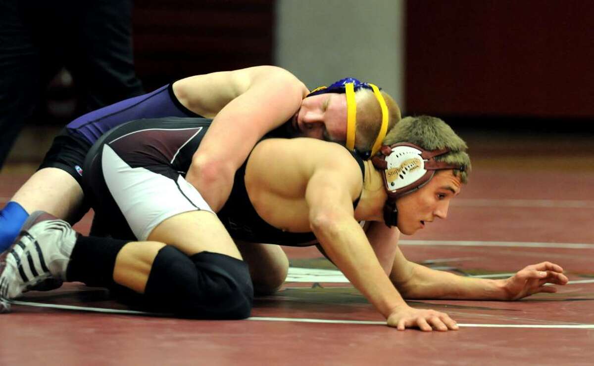 Lansingburgh's Austin Schnapp, right, works on his escape from Voorheesville's Dylan Foster, left, during their 160-pound wrestling match on Thursday, Dec. 10, 2009, in Lansingburgh, N.Y. Schnapp pinned Foster in 5:05, and Lansingburgh won the meet 42-24. (Cindy Schultz / Times Union)