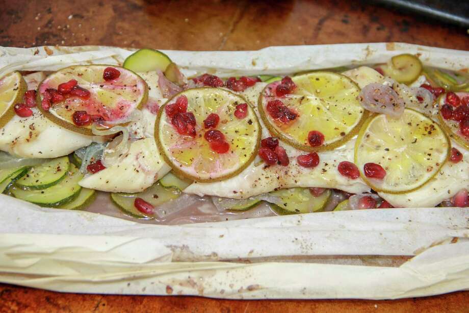 Cod with Pomegranate and Zucchini en Papillote is cooked in a steamy parchment-paper pouch. Photo: Melissa D'Arabian, UGC / Melissa d'Arabian