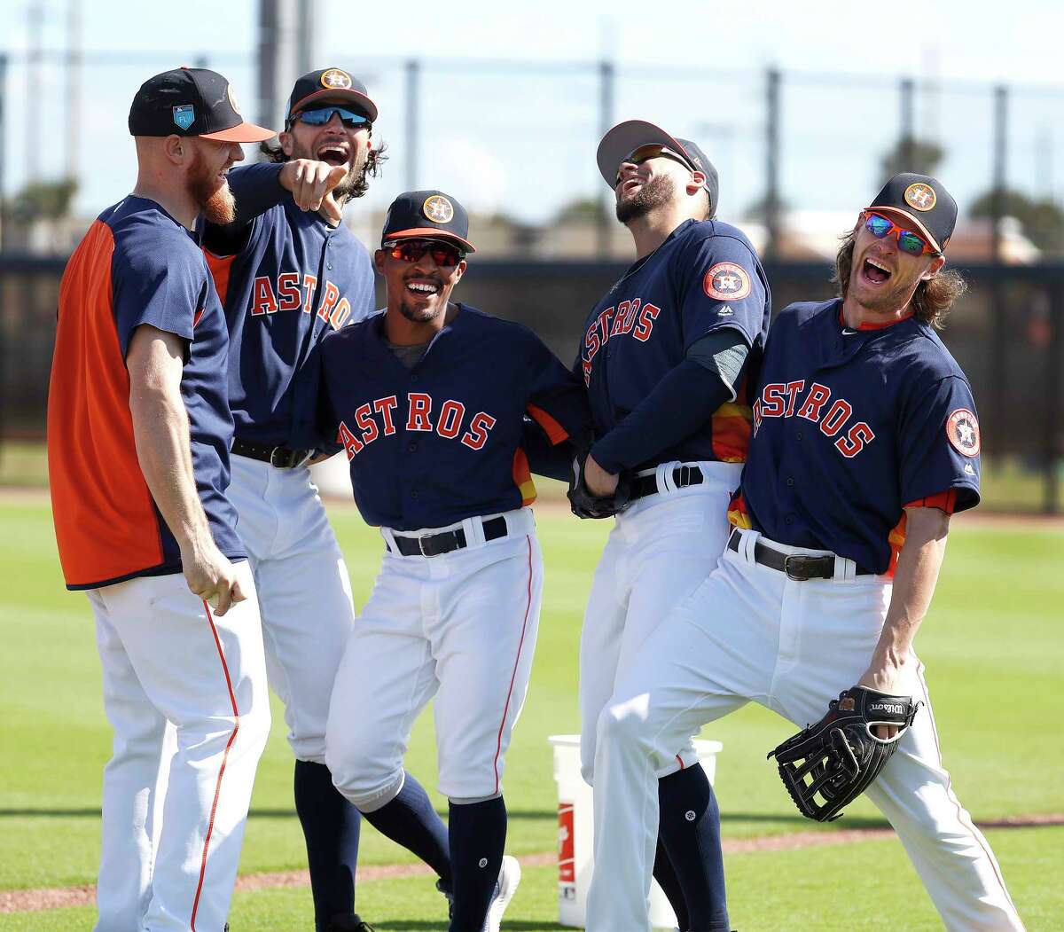 Houston Astros Derek Fisher (21), Jake Marisnick (6), Tony Kemp (18), George Springer (4), and Josh Reddick (22) laugh together as full squad workouts began during spring training day at The Ballpark of the Palm Beaches, Monday, Feb. 19, 2018, in West Palm Beach .