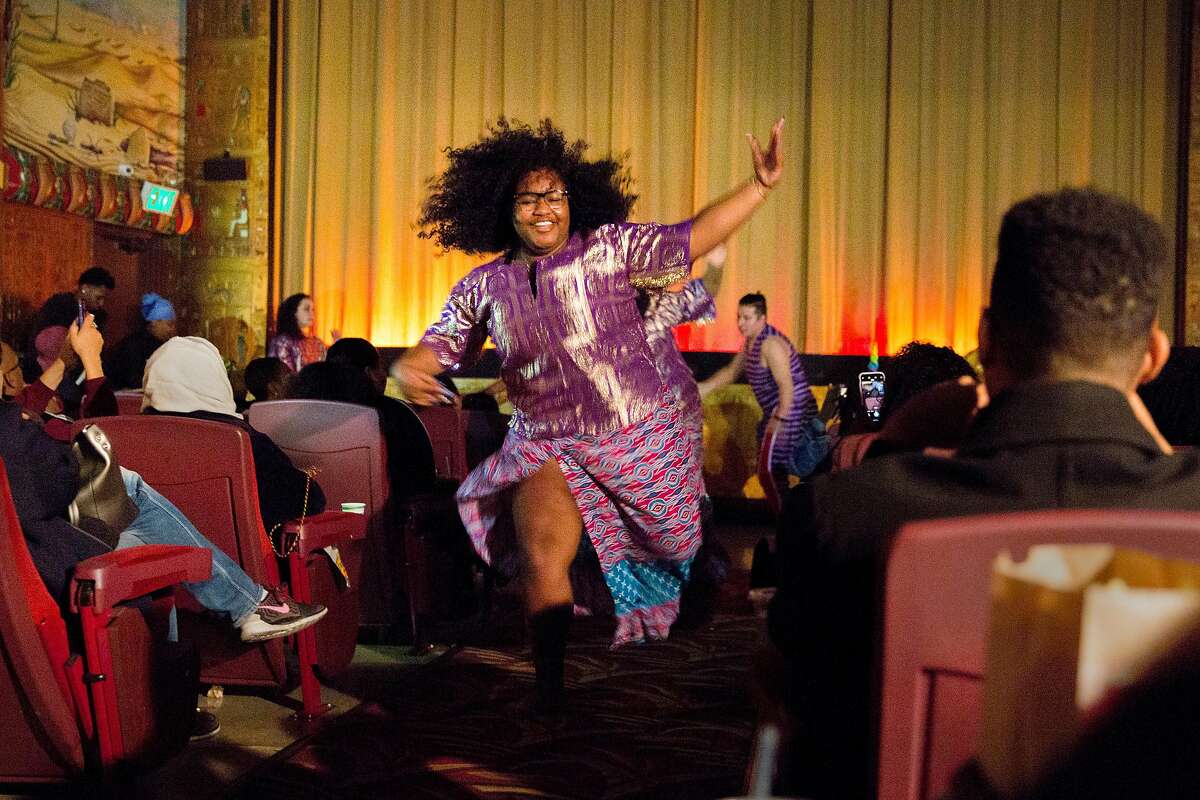 Kendra Bowman, 17, of the Berkeley High School Afro-Haitian Dance performs before a screening of Black Panther at the Grand Lake Theater Monday, Feb. 19, 2018, in Oakland, Calif.